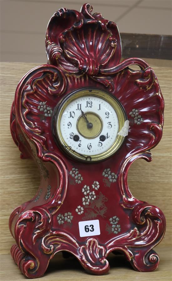 A Victorian ceramic cased eight day mantel clock